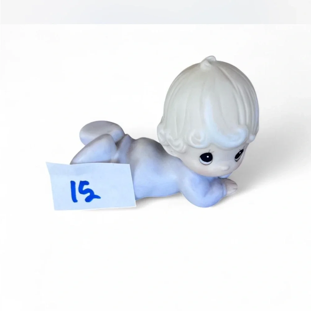 Adorable Precious Moments little girl lying down figurine in excellent condition